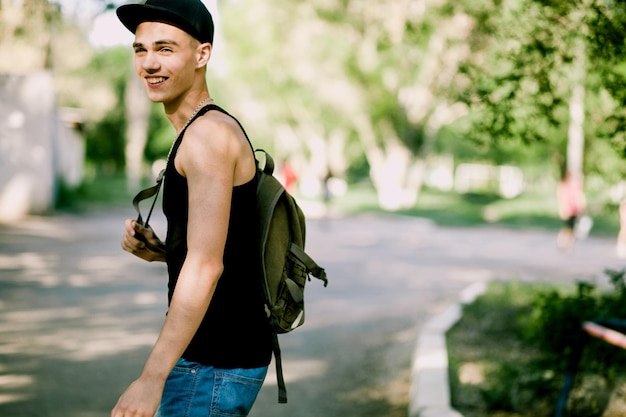 Teenager walk with backpack Hip hop teenager walk on street