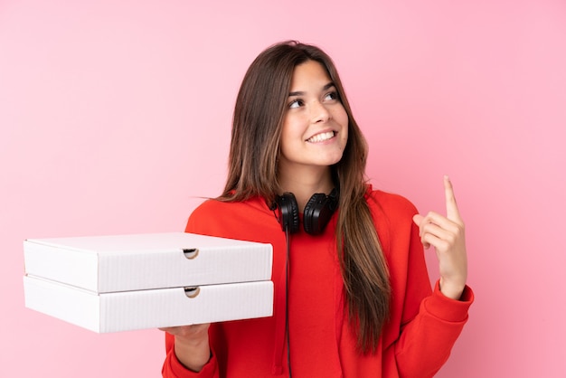 Teenager woman holding pizzas