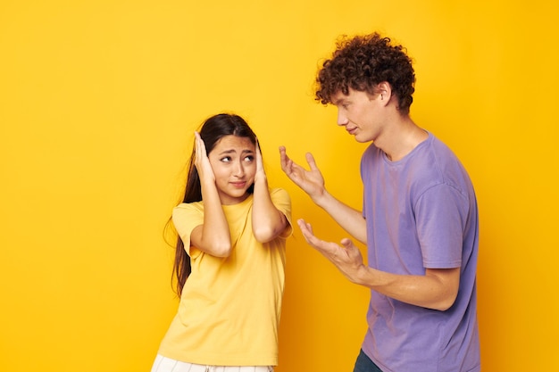 Teenagers in colorful tshirts posing friendship fun isolated background unaltered