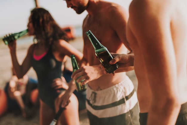 Teenagers Company are Drinking Beer.