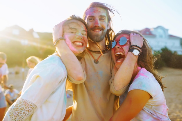 Teenagers Friends have fun at the holi festival Beach Party Celebrating traditional indian spring holiday