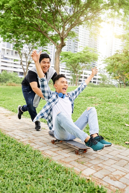 Teenagers skateboarding in the park