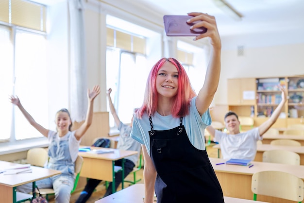 Teenagers students having fun in the classroom