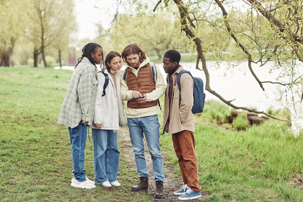 Teenagers using tablet pc to find the way