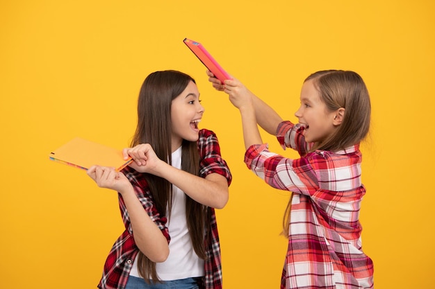 Teens ready to study. happy childhood. cheerful kids going to do homework with books.