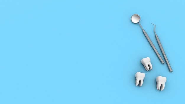 Фото Зубы и стоматологический инструмент стоматологическое зеркало и крючок с зубами на синем фоне