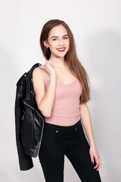 Premium Photo  Studio fashion shot of the lovely young woman portrait of  beautiful girl dressed in black underwear and jacket seductive lady against  gray background