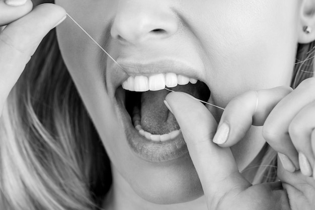 Teeth Flossing Woman use dental floss white healthy teeth Dental flush woman flossing teeth