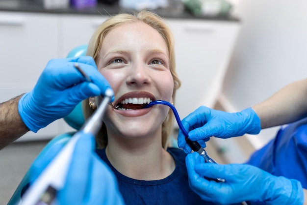 Teeth health concept Cropped photo of smiling woman mouth under treatment at dental clinic panorama