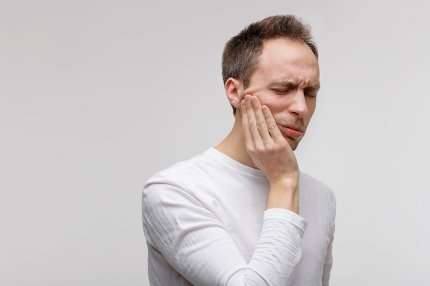 Teeth problem, male suffering from toothache