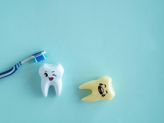 Teeth and toothbrush on a blue background