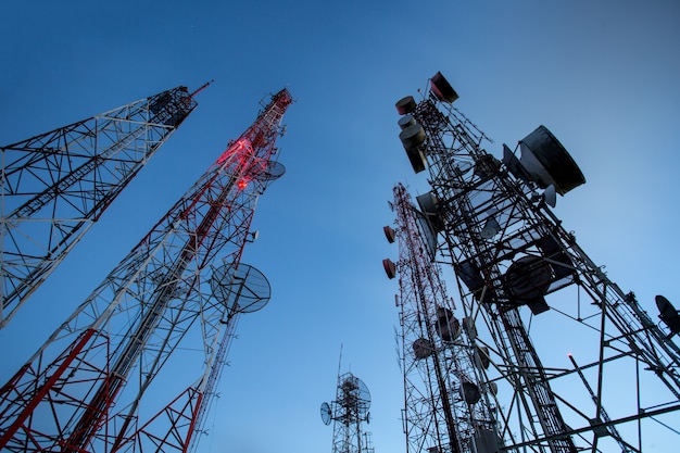 Telecommunication mast TV antennas wireless technology with blue sky in the morning