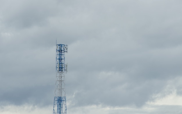 Photo telecommunication tower. cell phone signal tower on sky background