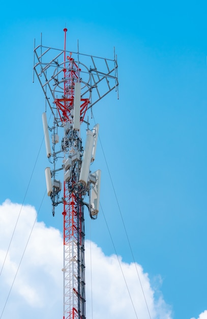 telecommunication tower with blue sky and white clouds background antenna on blue sky