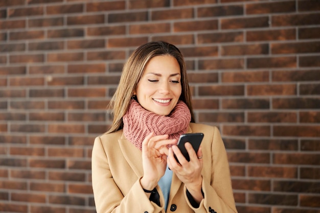 Telecommunications and 5g technology A woman using her phone