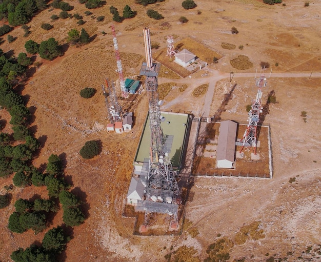 Telecommunications station. radio, television, mobile and\
internet antennas. top aerial view.