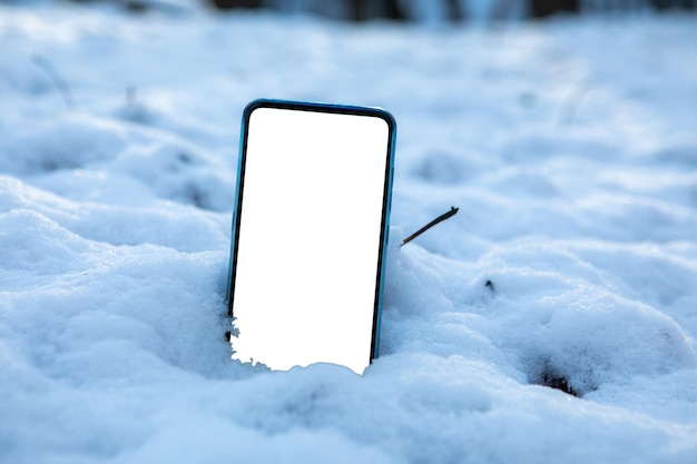 Telefoon in sneeuwwit leeg scherm kopieerruimte
