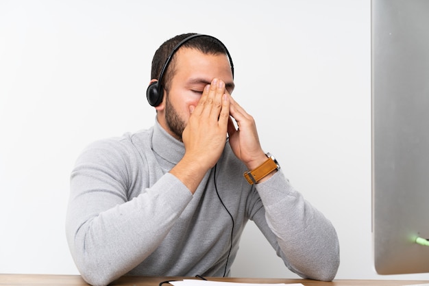 Telemarketer Colombian man working in a office