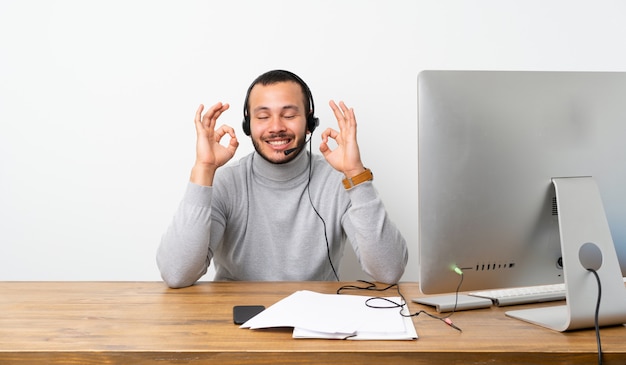 Telemarketer Colombian man in zen pose