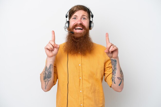 Telemarketer man isolated on white background pointing up a great idea