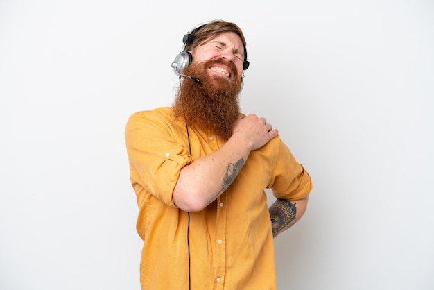 Telemarketer man isolated on white background suffering from pain in shoulder for having made an effort