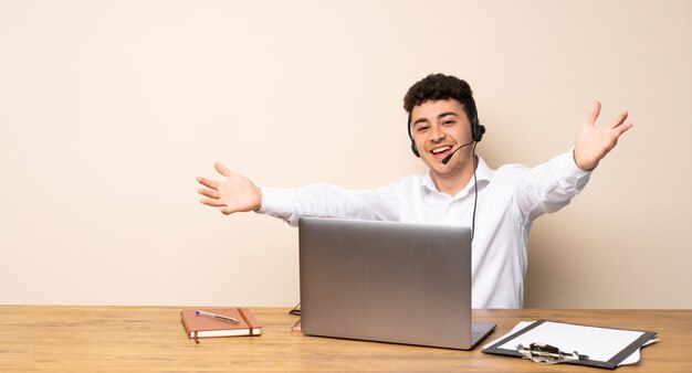 Telemarketer man presenting and inviting to come with hand