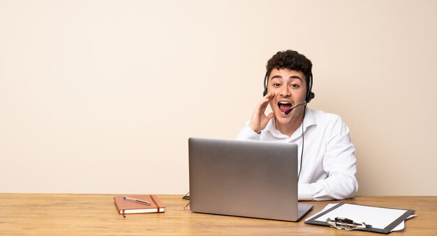 Telemarketer man shouting with mouth wide open to the lateral