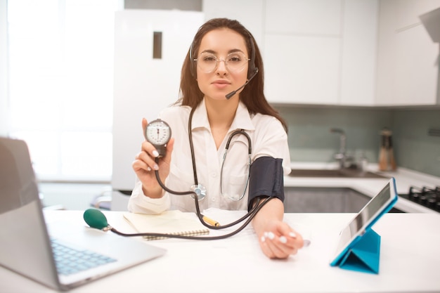 Telemedicine. A woman doctor is working from home