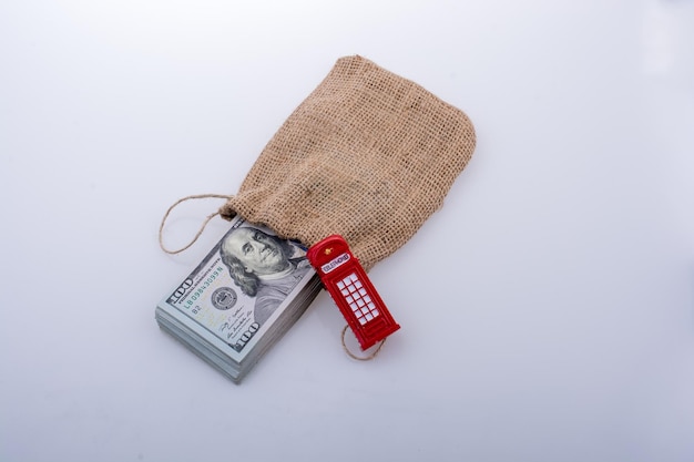 Telephone booth and bundle of dollar