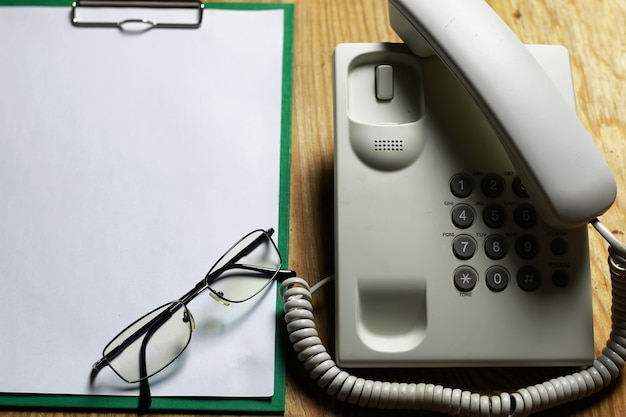 Telephone domestic on wooden background concept of 911 emergency