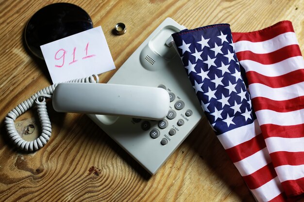 Telephone domestic on wooden background concept of 911 emergency