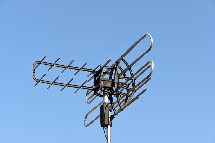 Photo television antenna with blue sky background