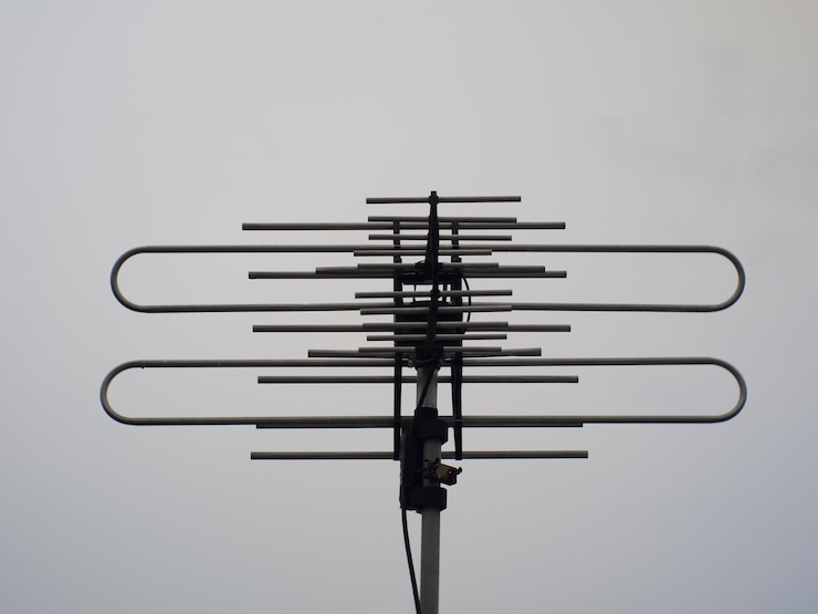 Photo television antenna with cloudy sky background