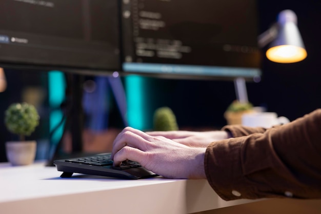 Photo teleworking system administrator typing on keyboard close up