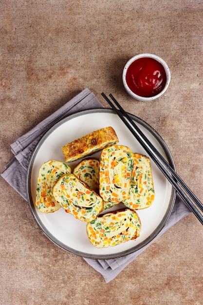 Telur dadar gulung Tamagoyaki or Japanses egg roll Gyeran Mari or Korean Rolled Omelette