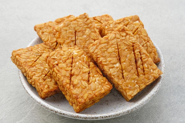 Tempeh Tempe Goreng or Fried tempeh is Indonesia traditional food made from fermented soybean seed