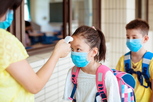 Photo temperature and medical check at school for covid19