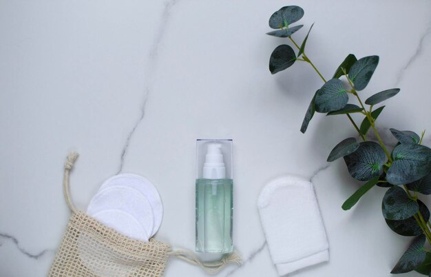 a template of natural cosmetics for skin care and cosmetic procedures with a top view of the leaves of the green. natural organic ingredients for cosmetics, skin care, body care.