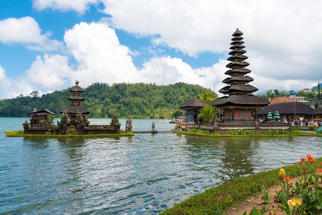 Temple by building against sky