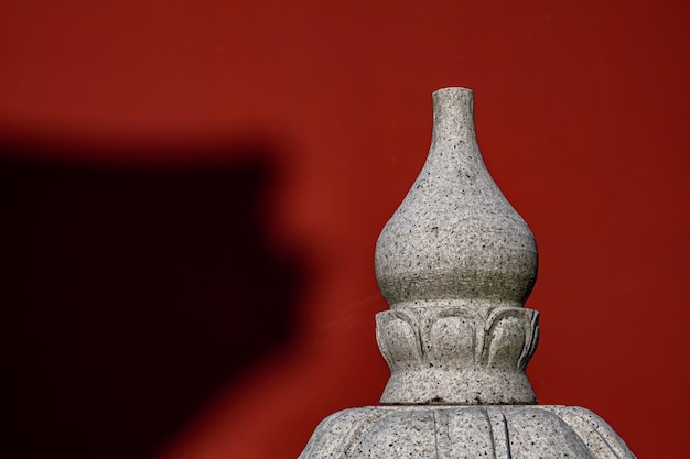 In a temple in fine weather, the sun cast some shadows on the red walls