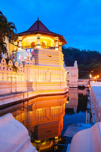 Temple of the Sacred Tooth Relic or Sri Dalada Maligawa in Kandy at sunset. Sacred Tooth Relic Temple is a Buddhist temple located in the royal palace complex of the Kingdom of Kandy.