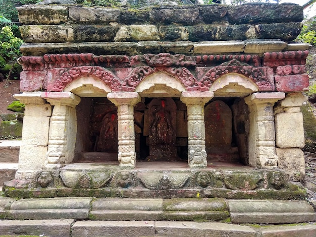 A temple with a red and white design on the top.