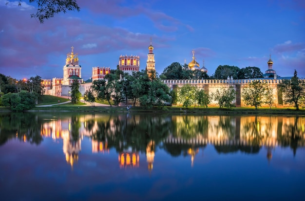 Temples and towers of the Novodevichy Convent and reflection Moscow