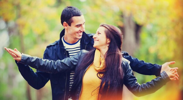 Ten couple at the park in autumn time