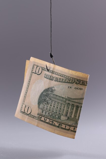 Ten dollars in air on gray background