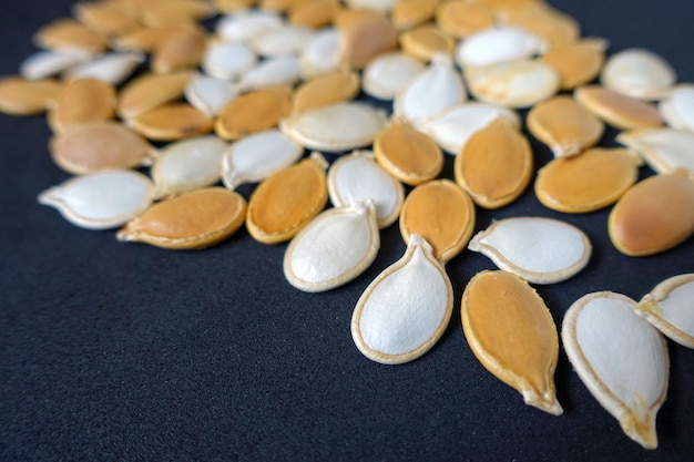 Ten slices of pumpkin seeds pumpkin seeds organic ancestor seeds closeup pumpkin seeds