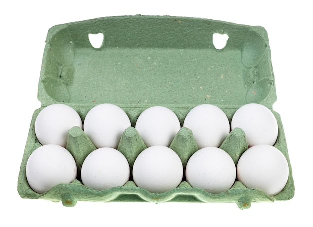 Ten white chicken eggs in green container isolated