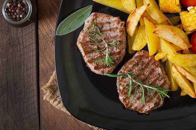 Tender and juicy veal steak medium rare with French fries