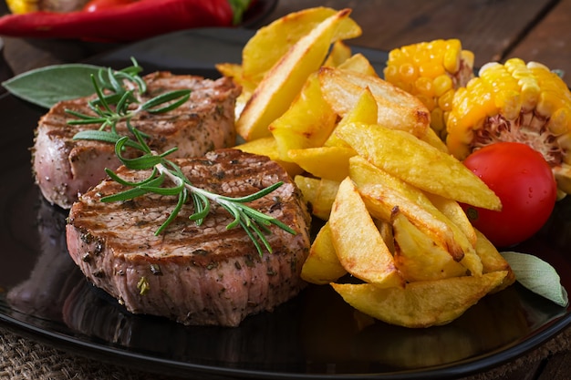 Tender and juicy veal steak medium rare with French fries