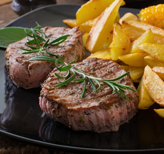 Tender and juicy veal steak medium rare with French fries